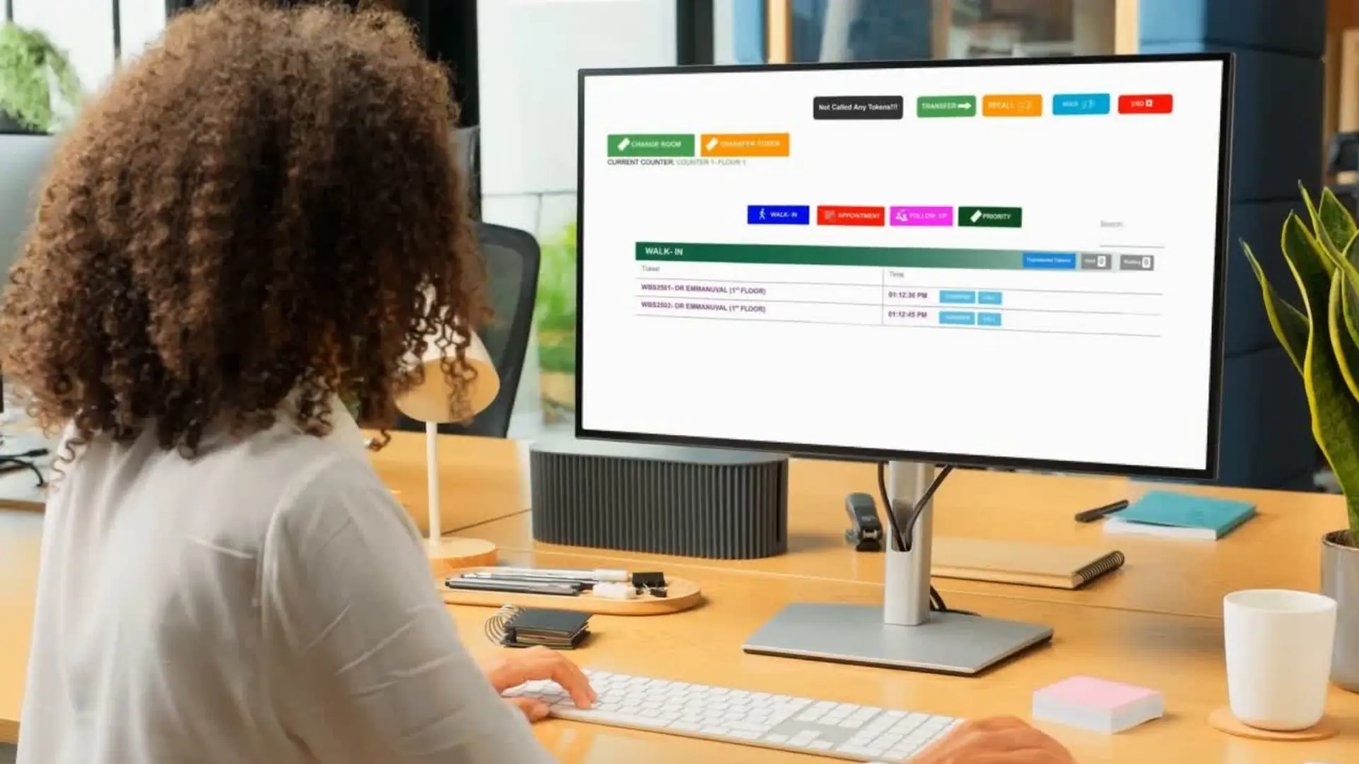 Queue management dashboard showing live patient tokens in hospital